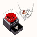 Rose heart necklace beside its open gift box with a preserved red rose