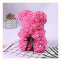 Pink rose bear made of foam roses with a black satin bow