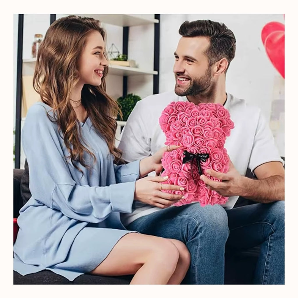 Someone being given the rose bear as a gift