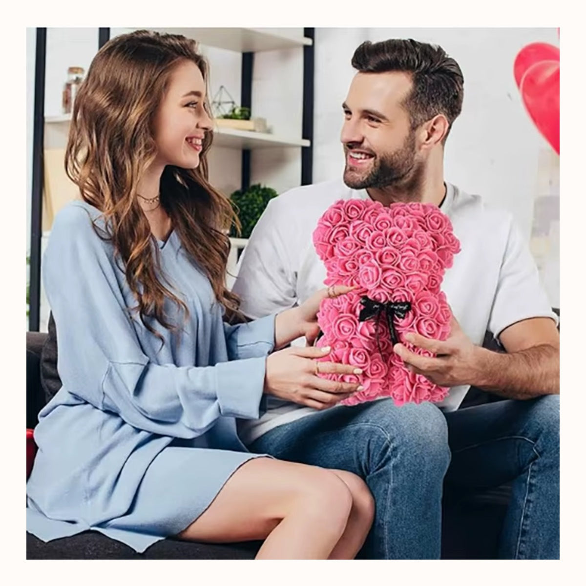 Someone being given the rose bear as a gift